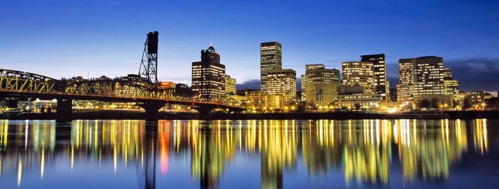 Skyline of Portland Oregon reflects in the Willamette River at dusk